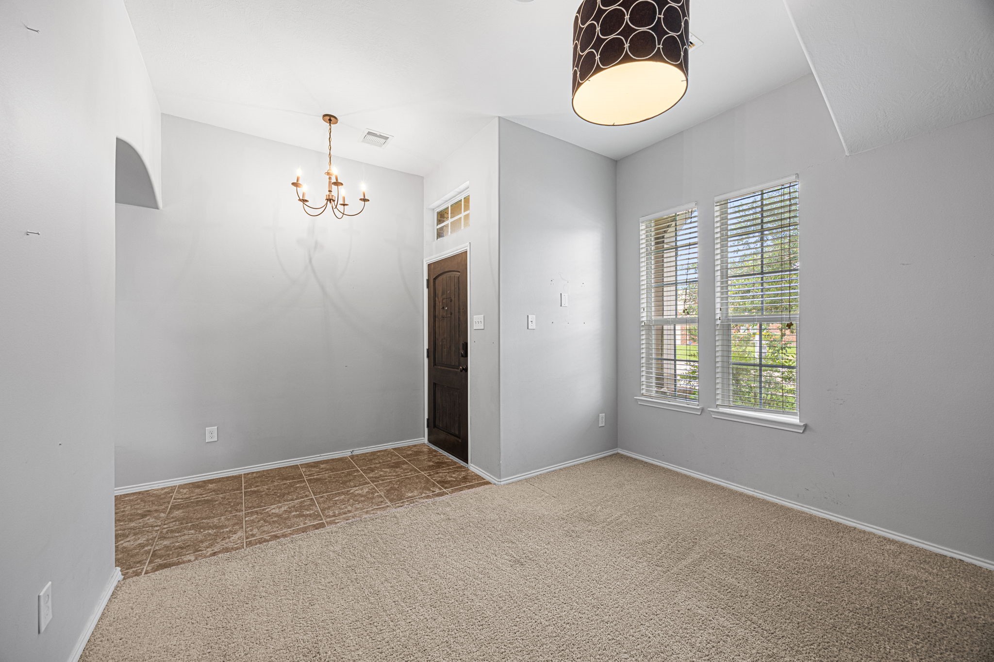 2211 Oak Rise Drive Conroe, TX 77304 - Photo 9 of 29 Bright flex room with chandelier and natural light