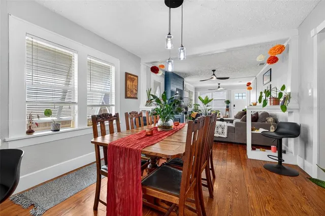a view of a dining room with furniture window and wooden floor