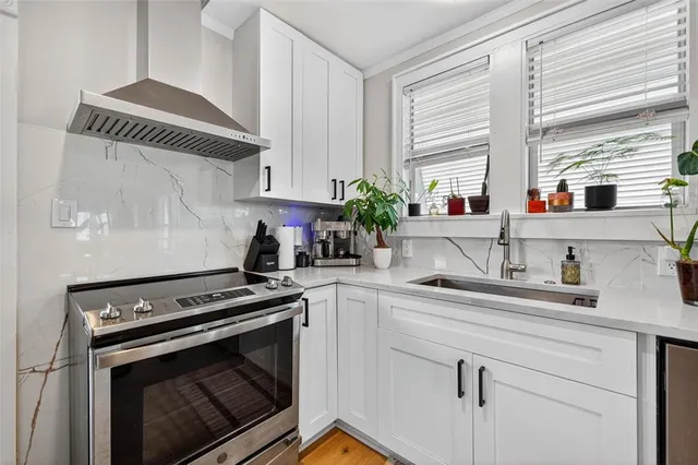 a kitchen with appliances cabinets and a window
