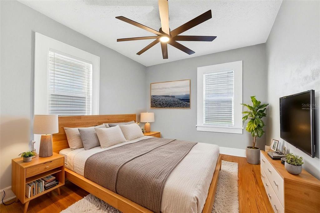 447 23rd Street North St. Petersburg, FL 33713 - Photo 21 of 28 a bedroom with a bed and a flat screen tv