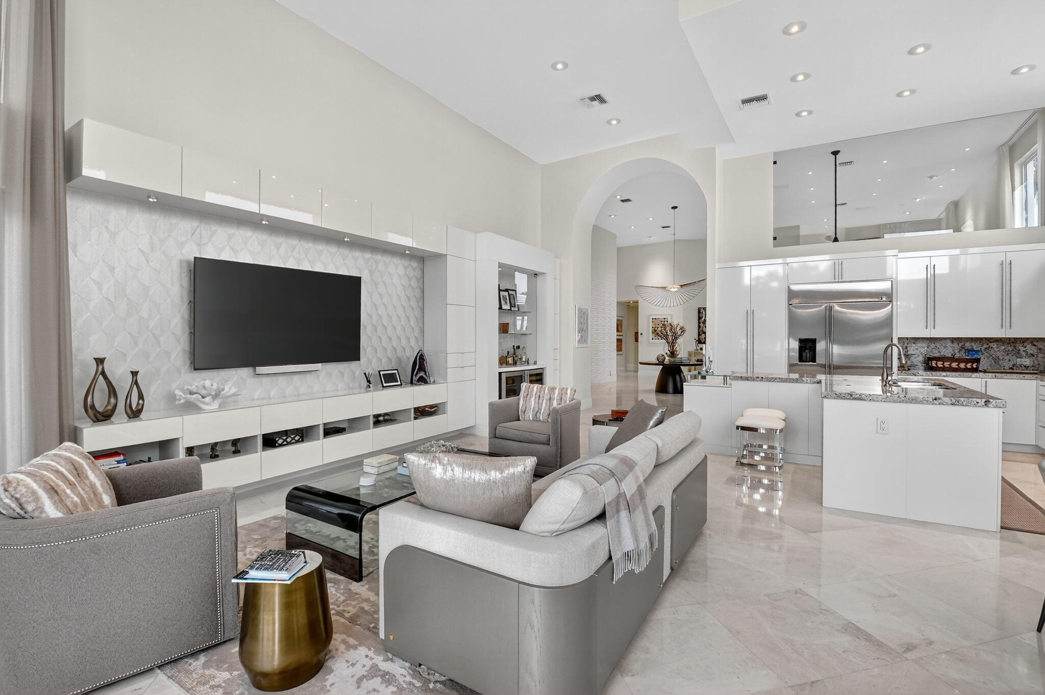 2563 Northwest 63rd Street Boca Raton, FL 33496 - Photo 19 of 65 a living room with furniture and a flat screen tv