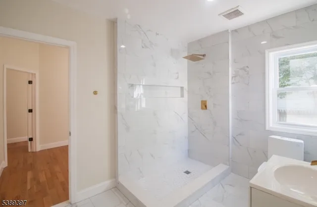 a bathroom with a shower bathtub and sink