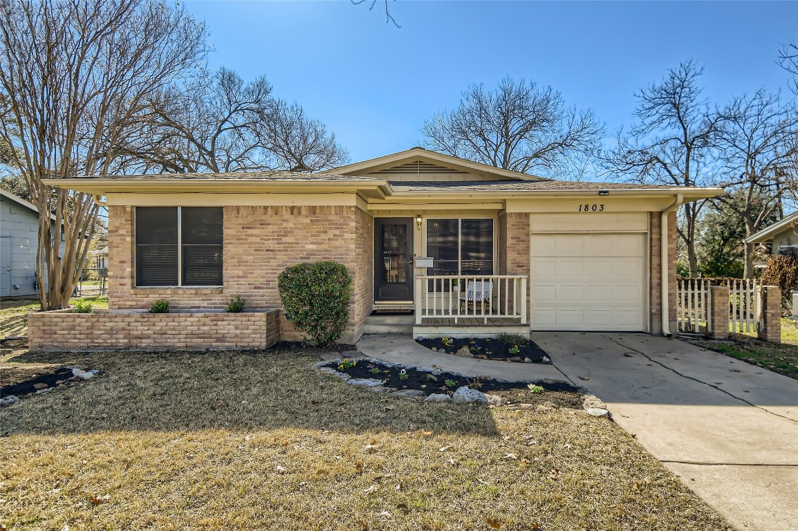 1803 Duke Avenue Austin, TX 78757 - Photo 1 of 1 a front view of a house with garden