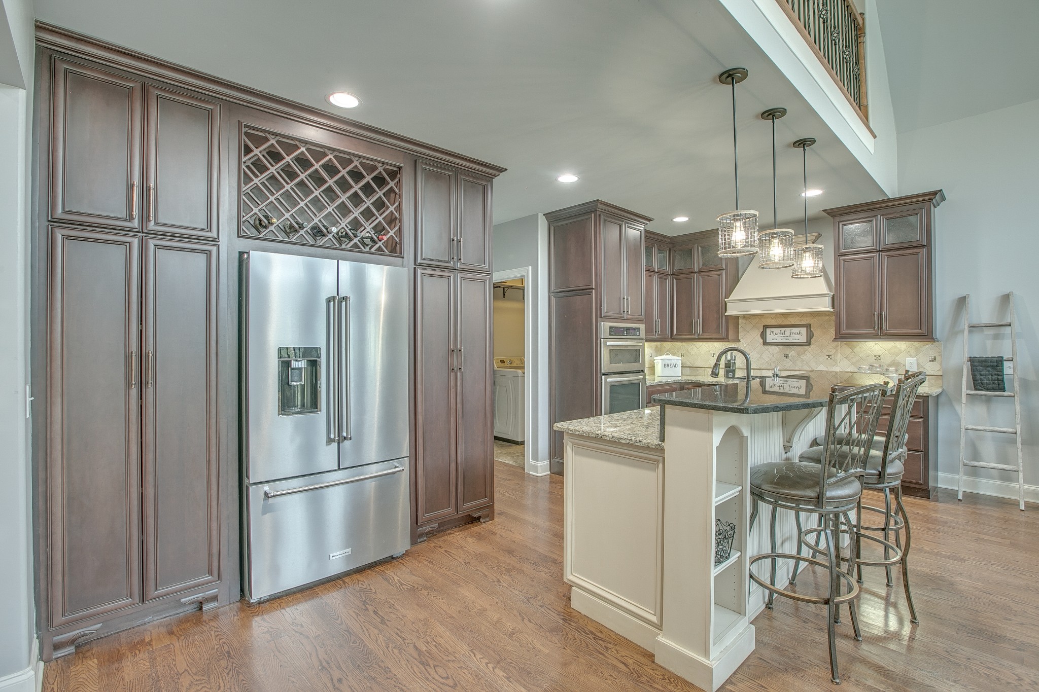 2727 Battleground Drive Murfreesboro, TN 37129 - Photo 11 of 31 a kitchen with kitchen island white cabinets and stainless steel appliances