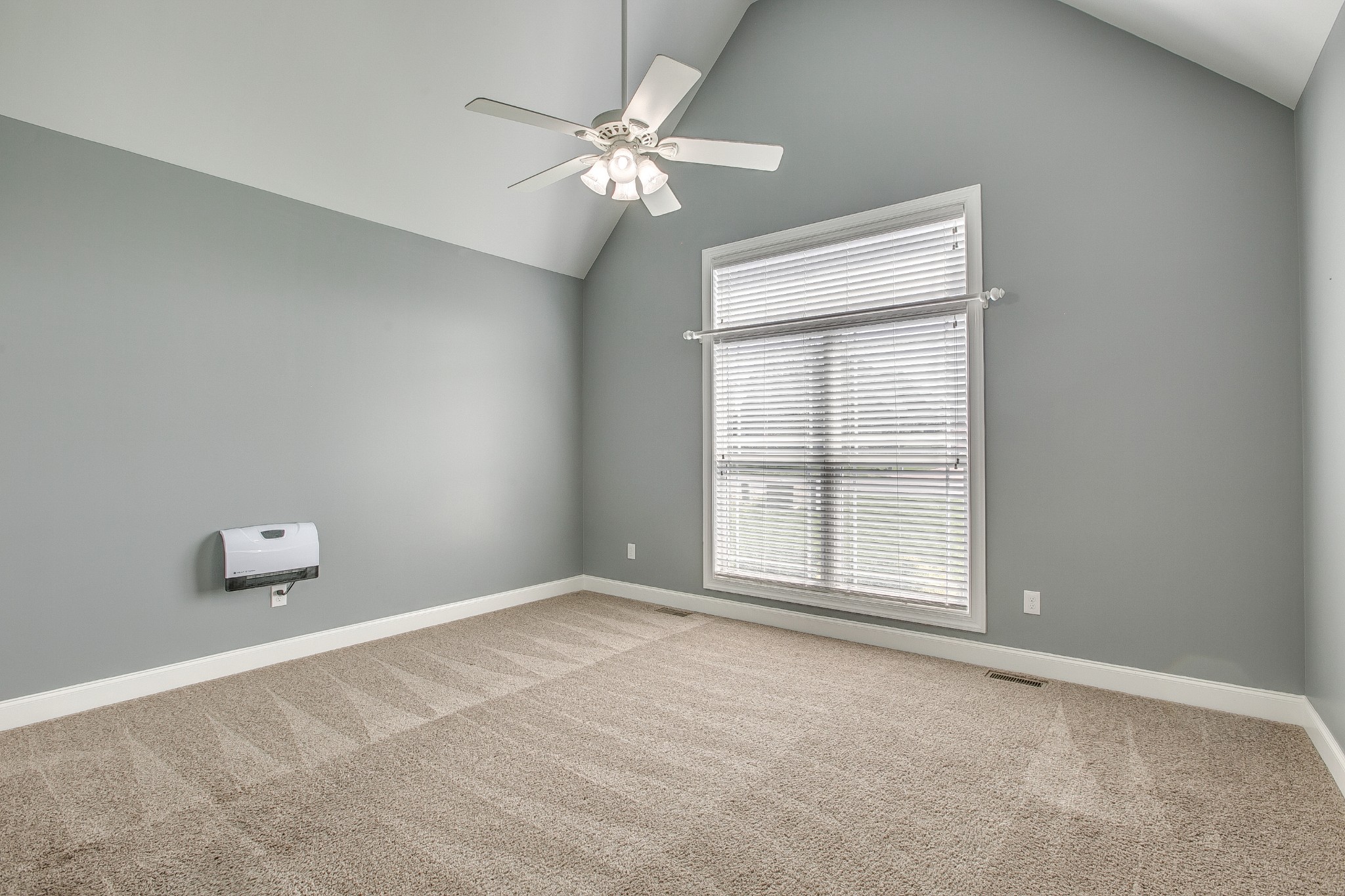 2727 Battleground Drive Murfreesboro, TN 37129 - Photo 19 of 31 an empty room with chandelier fan and windows
