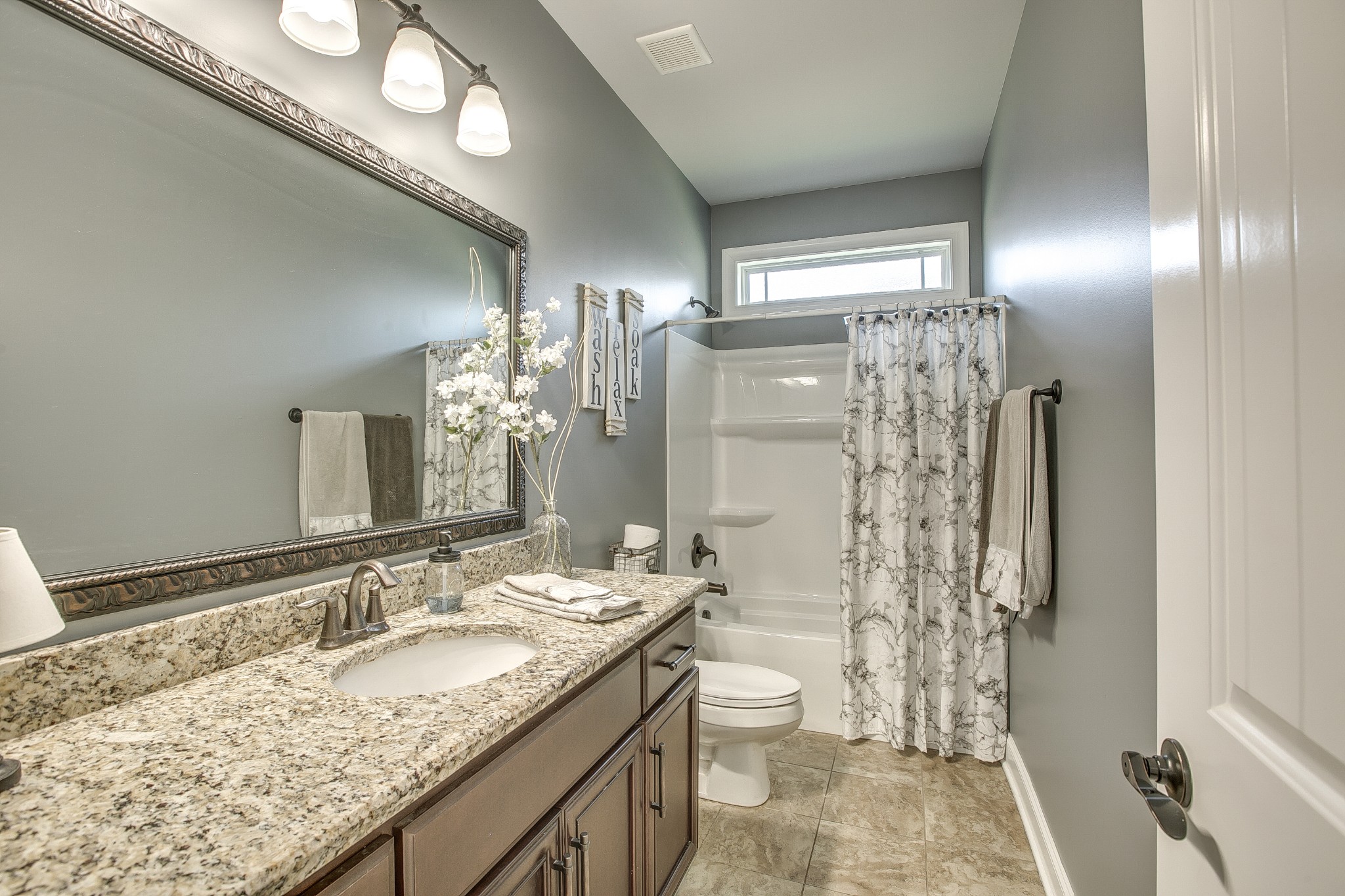2727 Battleground Drive Murfreesboro, TN 37129 - Photo 20 of 31 a bathroom with a granite countertop sink toilet and shower