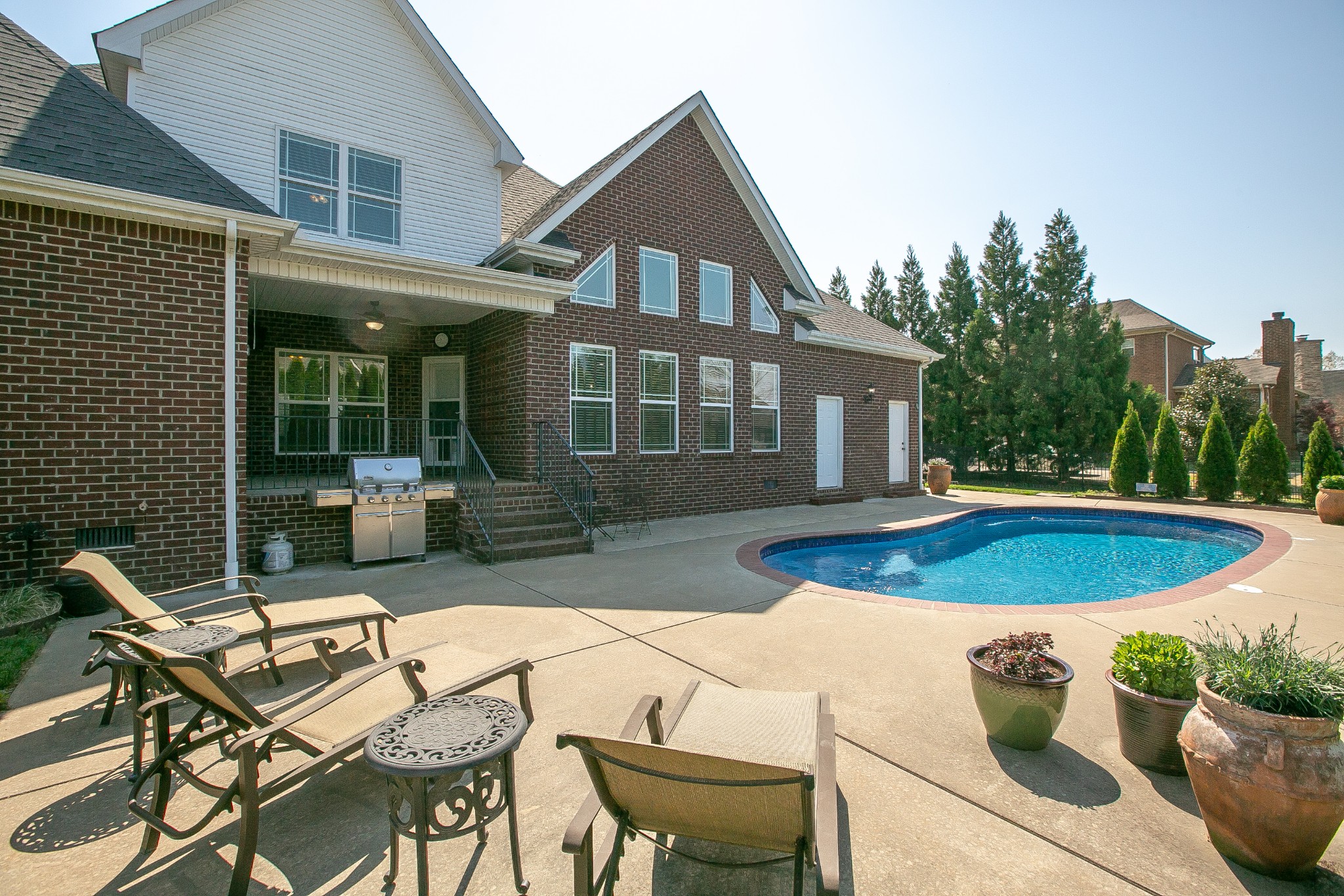 2727 Battleground Drive Murfreesboro, TN 37129 - Photo 30 of 31 a view of a house with backyard sitting area and swimming pool