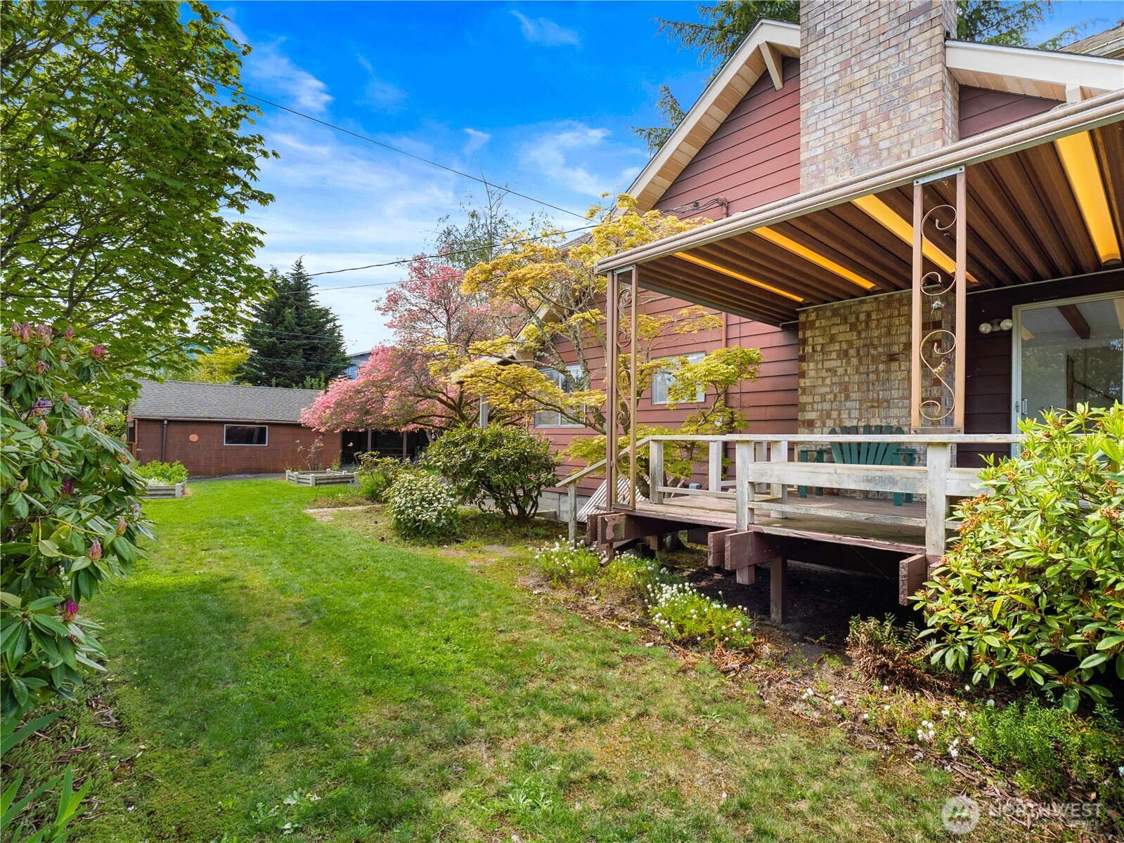 5704 North Ruby Street Tacoma, WA 98407 - Photo 30 of 38 a backyard of a house with a garden and outdoor seating