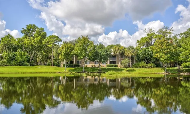 a view of a lake with a big yard