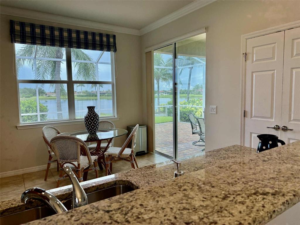 19240 Isadora Street Venice, FL 34293 - Photo 14 of 41 a view of a workspace with furniture and a window