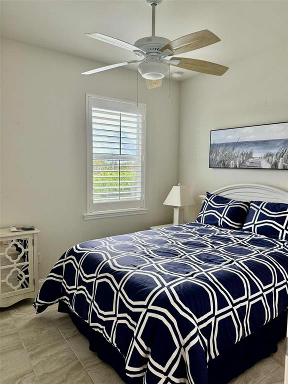 19240 Isadora Street Venice, FL 34293 - Photo 21 of 41 a bedroom with a bed and a window