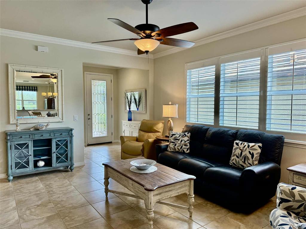 19240 Isadora Street Venice, FL 34293 - Photo 3 of 41 a living room with furniture and a fireplace
