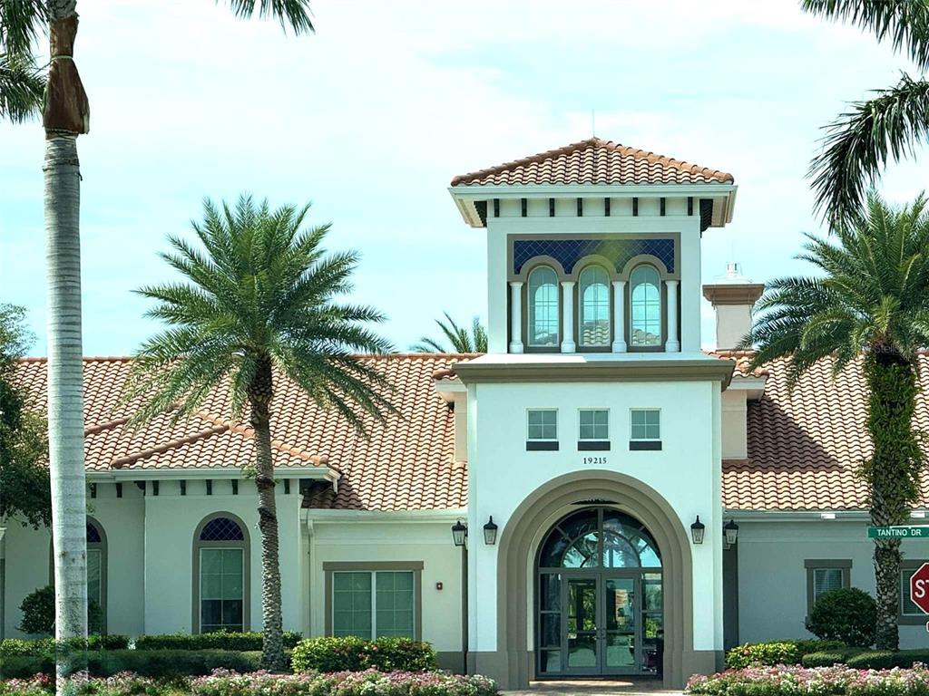 19240 Isadora Street Venice, FL 34293 - Photo 34 of 41 a front view of a house with a garden