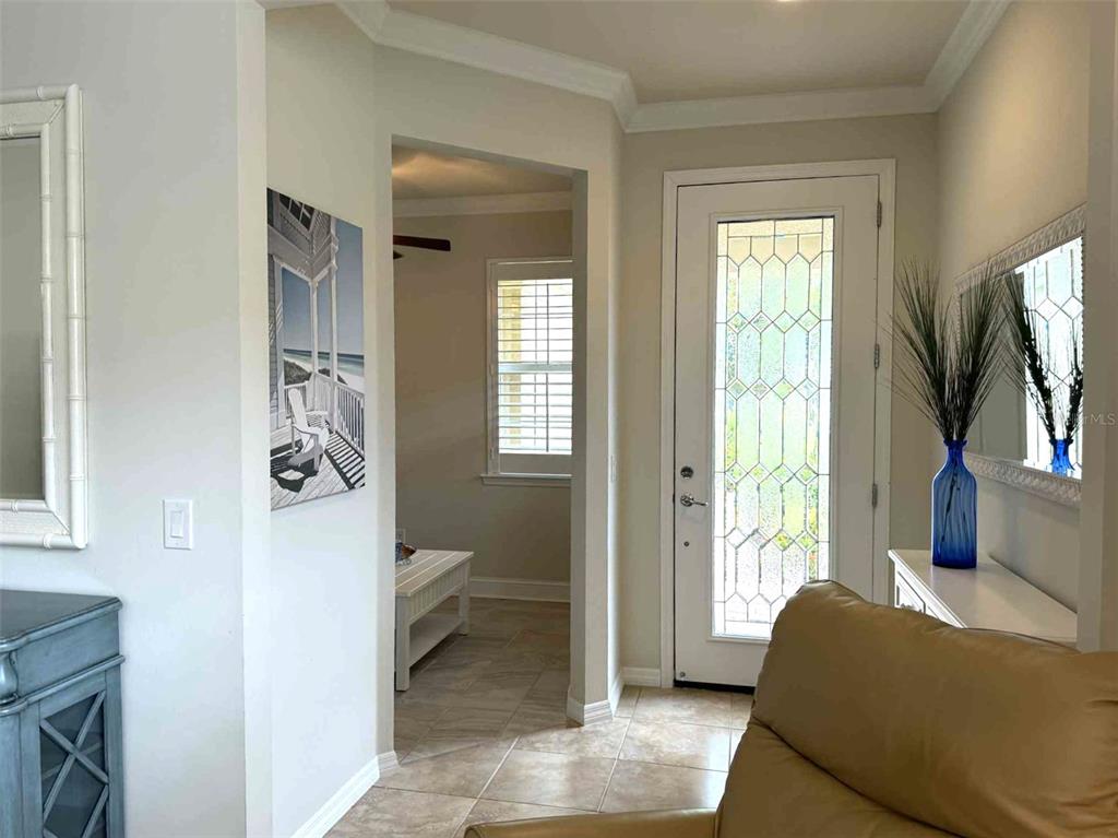 19240 Isadora Street Venice, FL 34293 - Photo 4 of 41 a living room with furniture and a flat screen tv