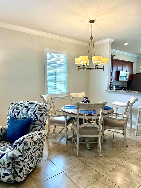 19240 Isadora Street Venice, FL 34293 - Photo 7 of 41 a dining room with furniture and window