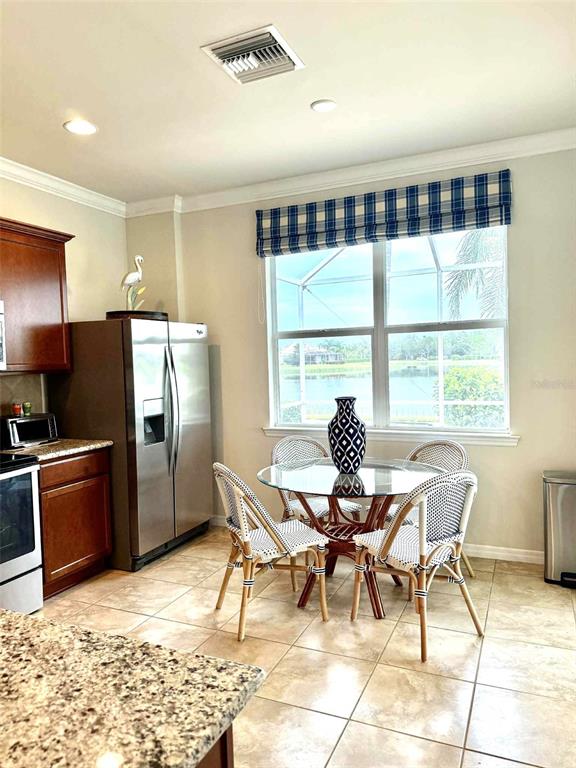 19240 Isadora Street Venice, FL 34293 - Photo 9 of 41 a view of a dining room with furniture window and outside view