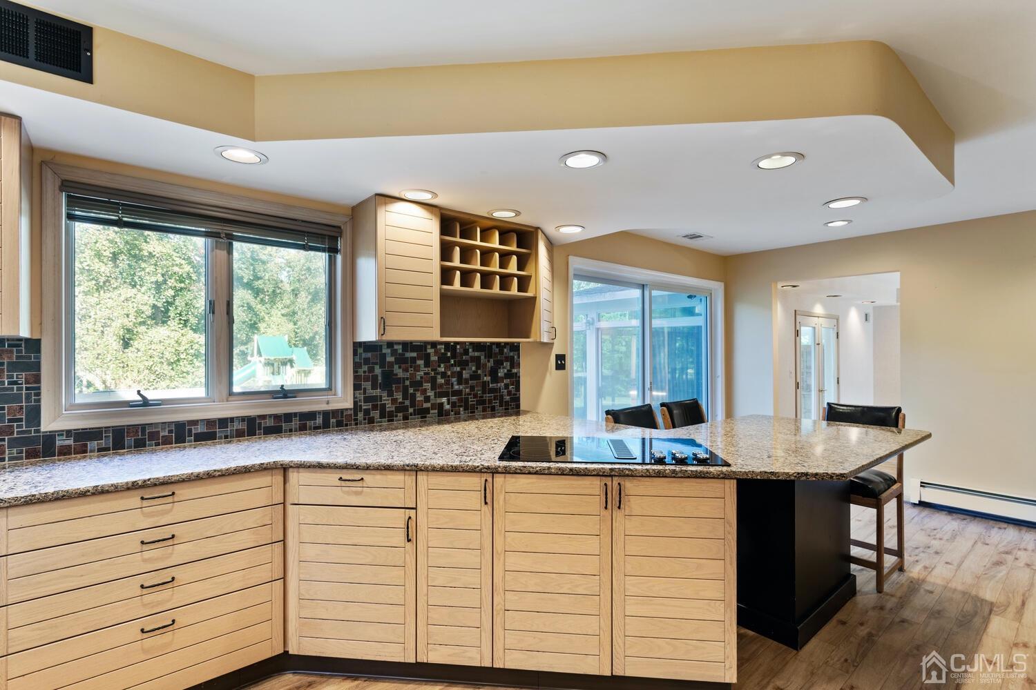 49 Brookside Road Millstone Township, NJ 08510 - Photo 11 of 60 a kitchen with a sink cabinets and a large window