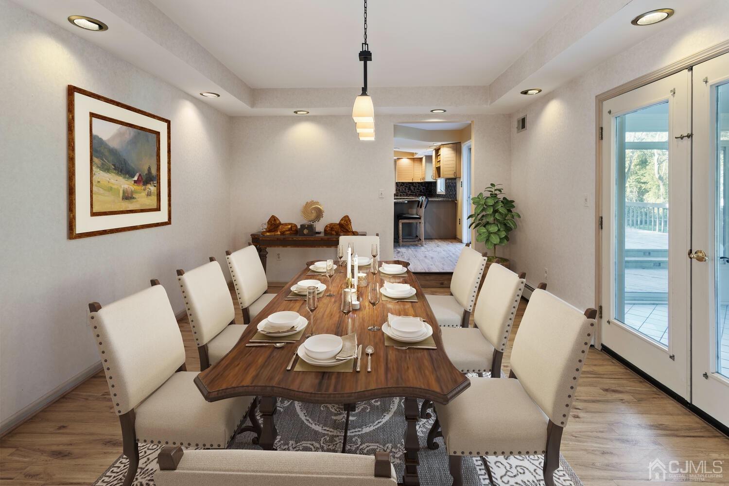 49 Brookside Road Millstone Township, NJ 08510 - Photo 15 of 60 a view of a dining room with furniture and wooden floor