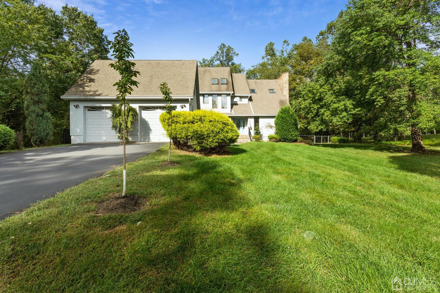 49 Brookside Road Millstone Township, NJ 08510 - Photo 3 of 60 a view of a garden