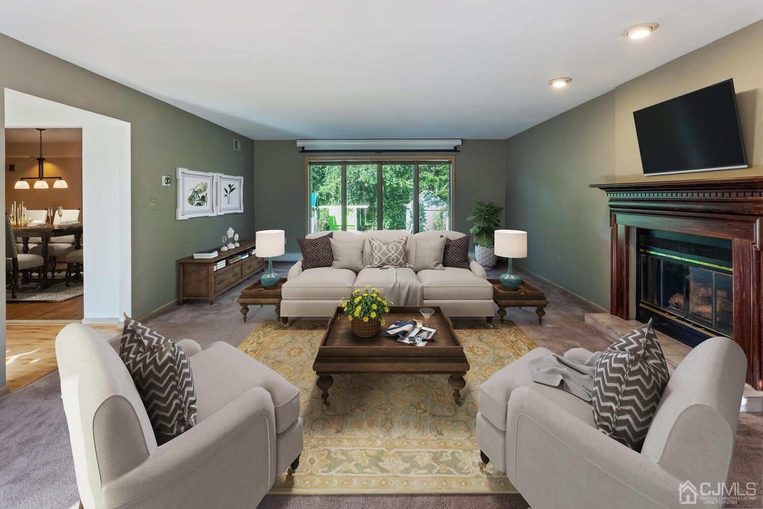 49 Brookside Road Millstone Township, NJ 08510 - Photo 23 of 60 a living room with furniture or fireplace and a flat screen tv