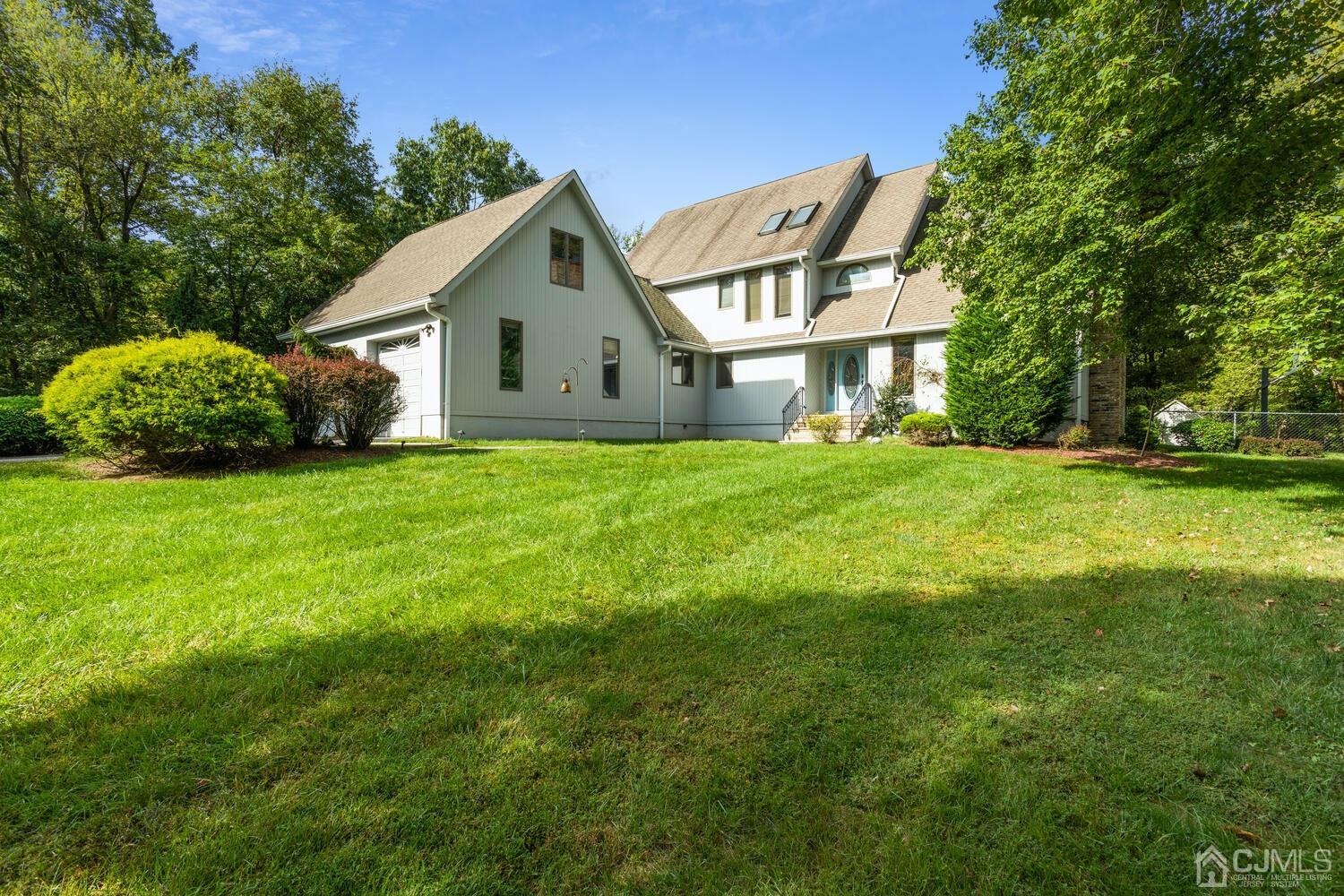 49 Brookside Road Millstone Township, NJ 08510 - Photo 4 of 60 a front view of house with yard and green space