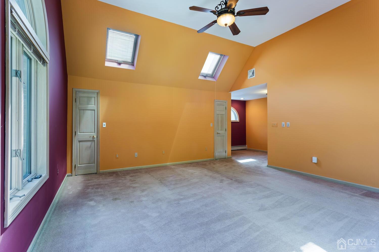 49 Brookside Road Millstone Township, NJ 08510 - Photo 33 of 60 a view of a livingroom with a ceiling fan and window