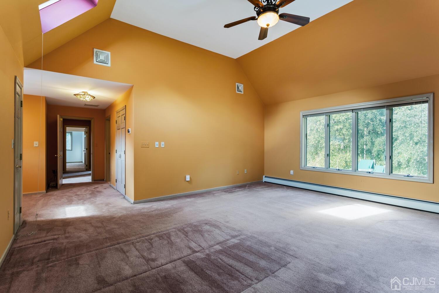 49 Brookside Road Millstone Township, NJ 08510 - Photo 34 of 60 a view of a livingroom with a ceiling fan and window