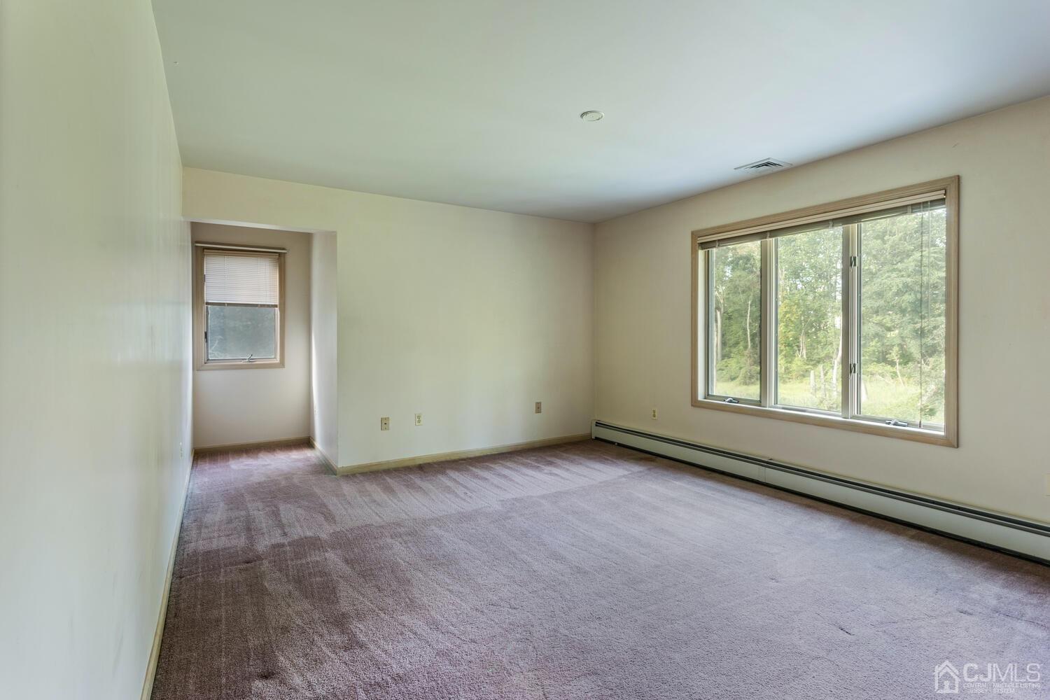 49 Brookside Road Millstone Township, NJ 08510 - Photo 36 of 60 an empty room with windows