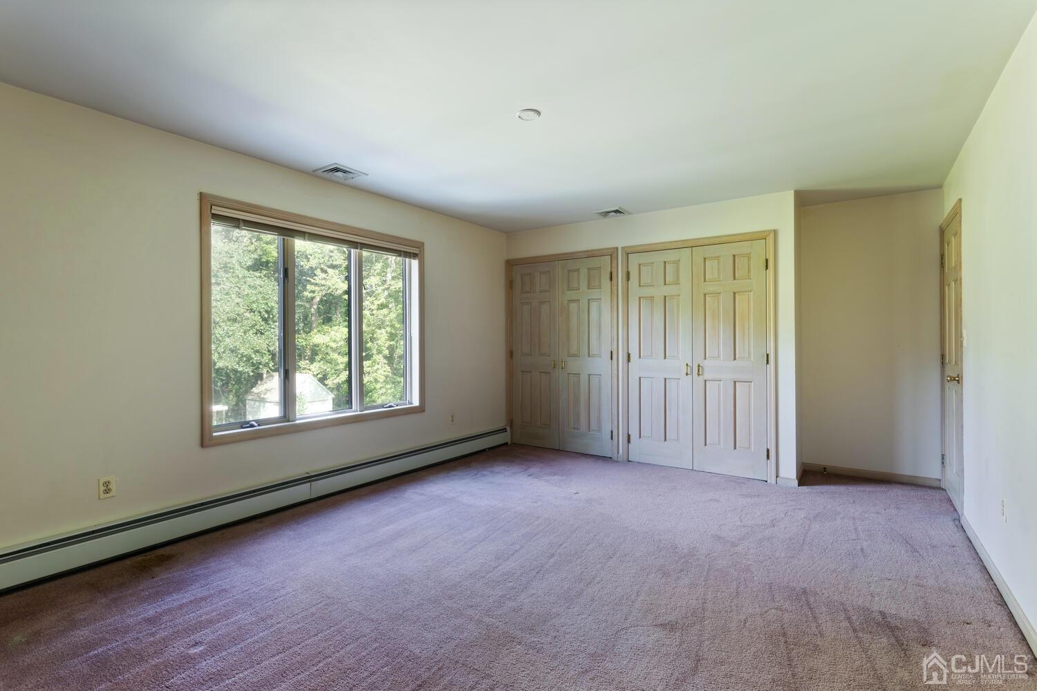 49 Brookside Road Millstone Township, NJ 08510 - Photo 37 of 60 an empty room with windows