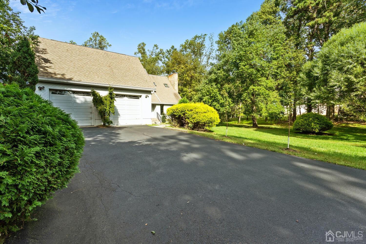 49 Brookside Road Millstone Township, NJ 08510 - Photo 5 of 60 a view of a street with houses