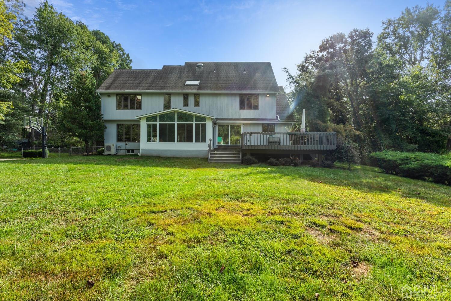 49 Brookside Road Millstone Township, NJ 08510 - Photo 51 of 60 a front view of a house with a yard