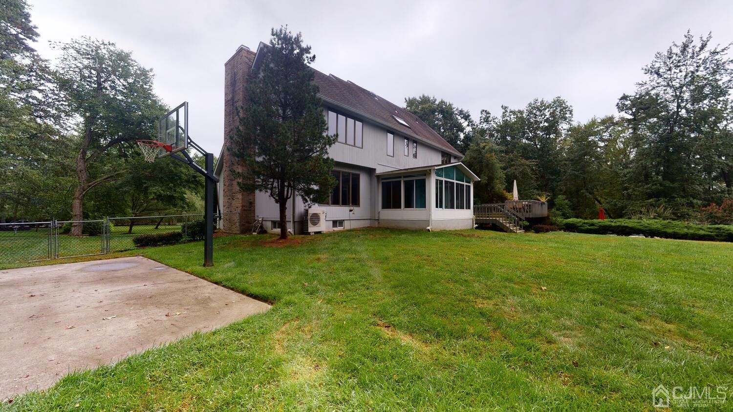 49 Brookside Road Millstone Township, NJ 08510 - Photo 54 of 60 a view of a house with a yard porch and sitting area