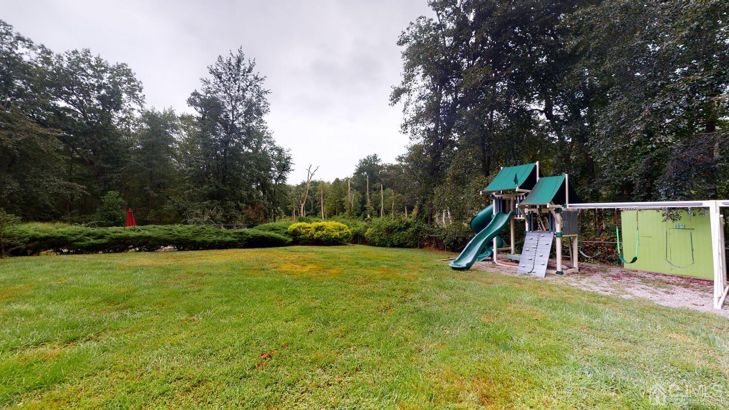 49 Brookside Road Millstone Township, NJ 08510 - Photo 56 of 60 a view of a park with swings