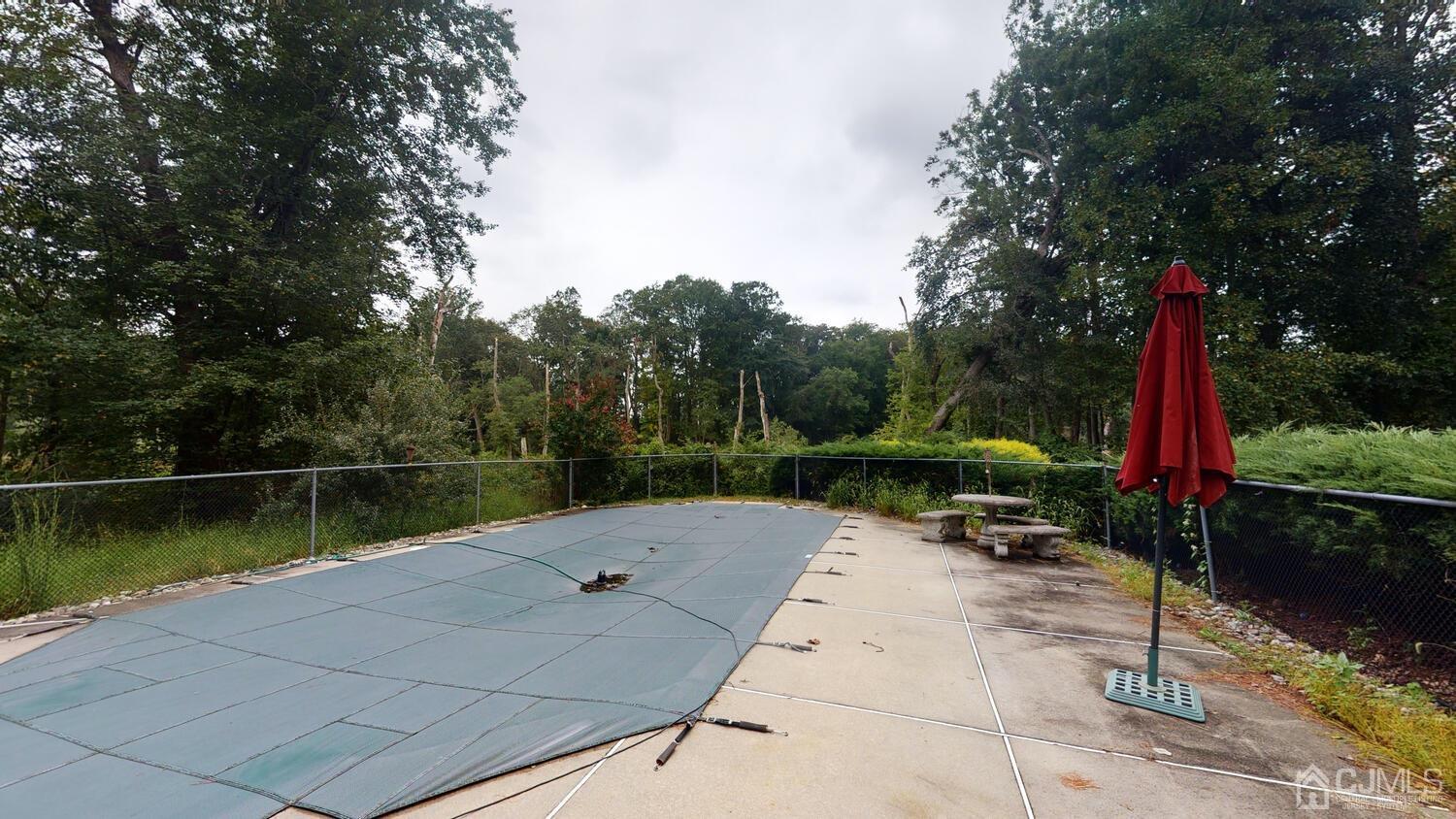 49 Brookside Road Millstone Township, NJ 08510 - Photo 58 of 60 a view of outdoor space with swimming pool and seating