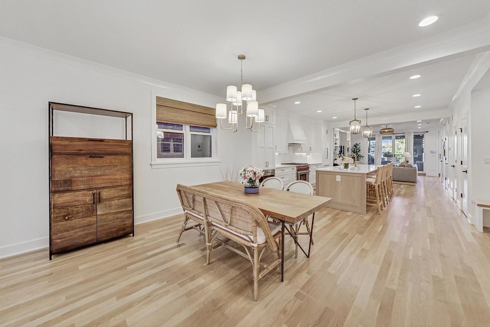 1509 West School Street, Unit 1 Chicago, IL 60657 - Photo 4 of 11 a view of a dining room with furniture and wooden floor
