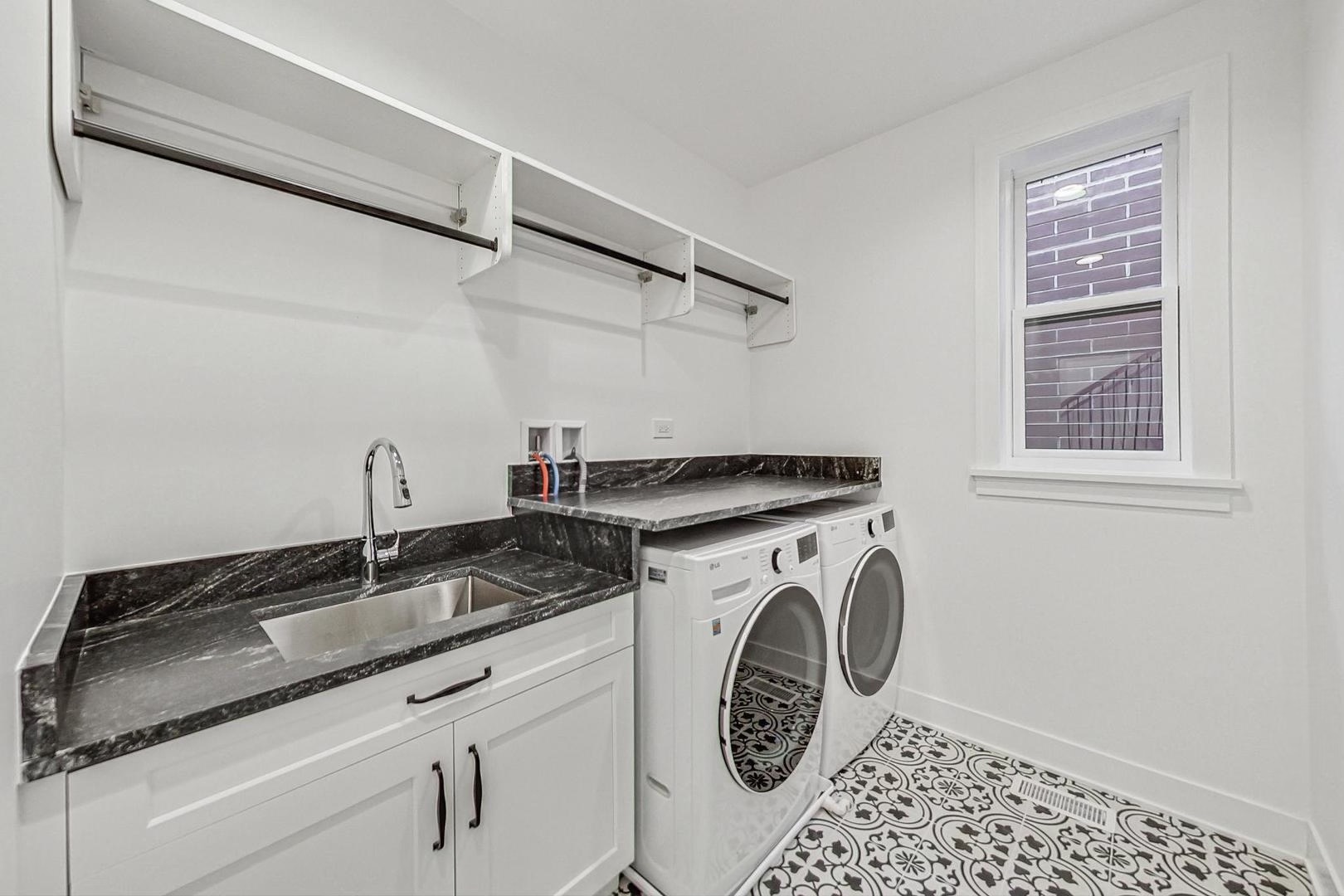 1509 West School Street, Unit 1 Chicago, IL 60657 - Photo 6 of 11 a utility room with dryer and washer
