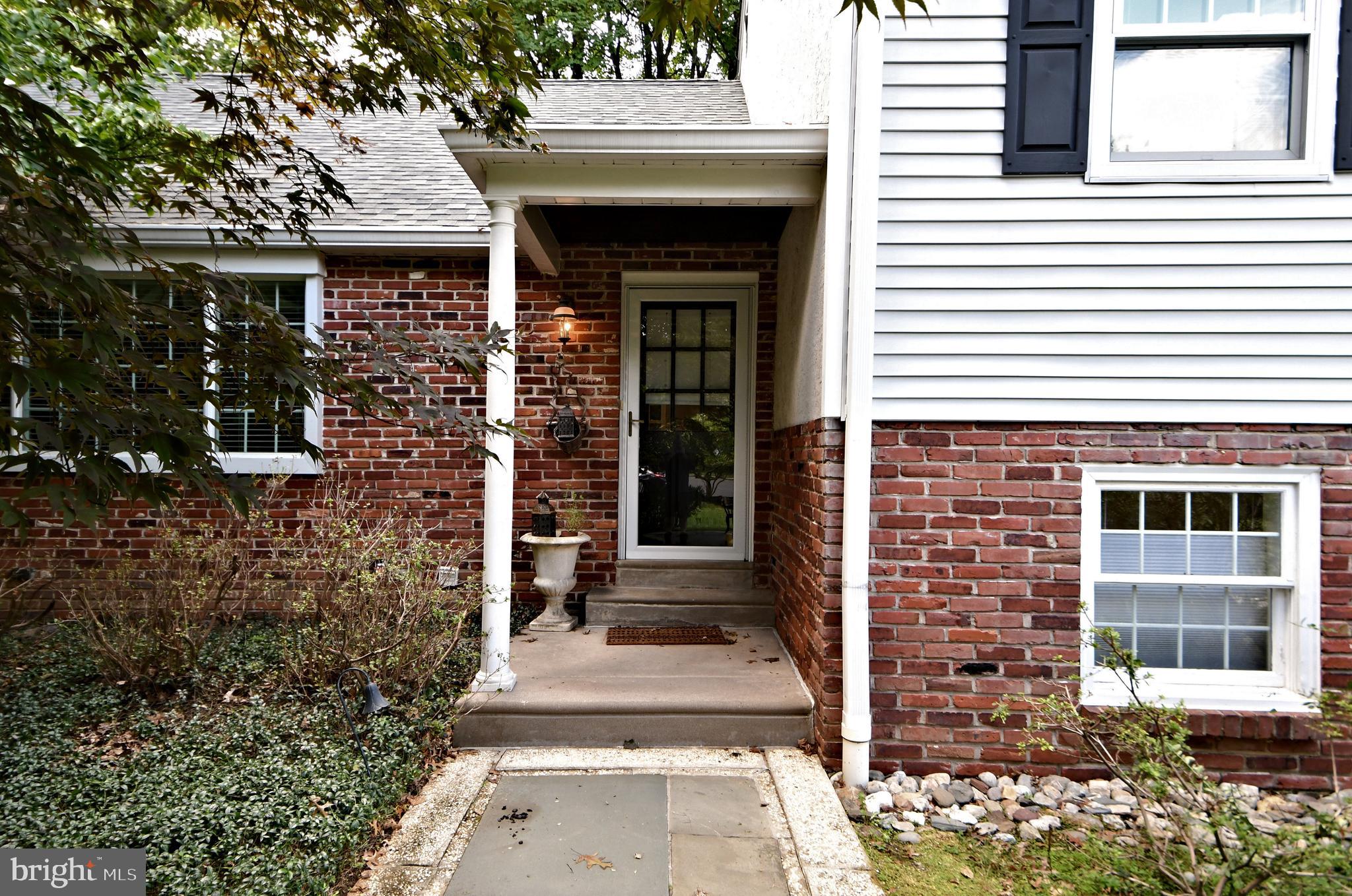 335 Powderhorn Road Fort Washington, PA 19034 - Photo 2 of 41 Covered entrance on brick and siding house