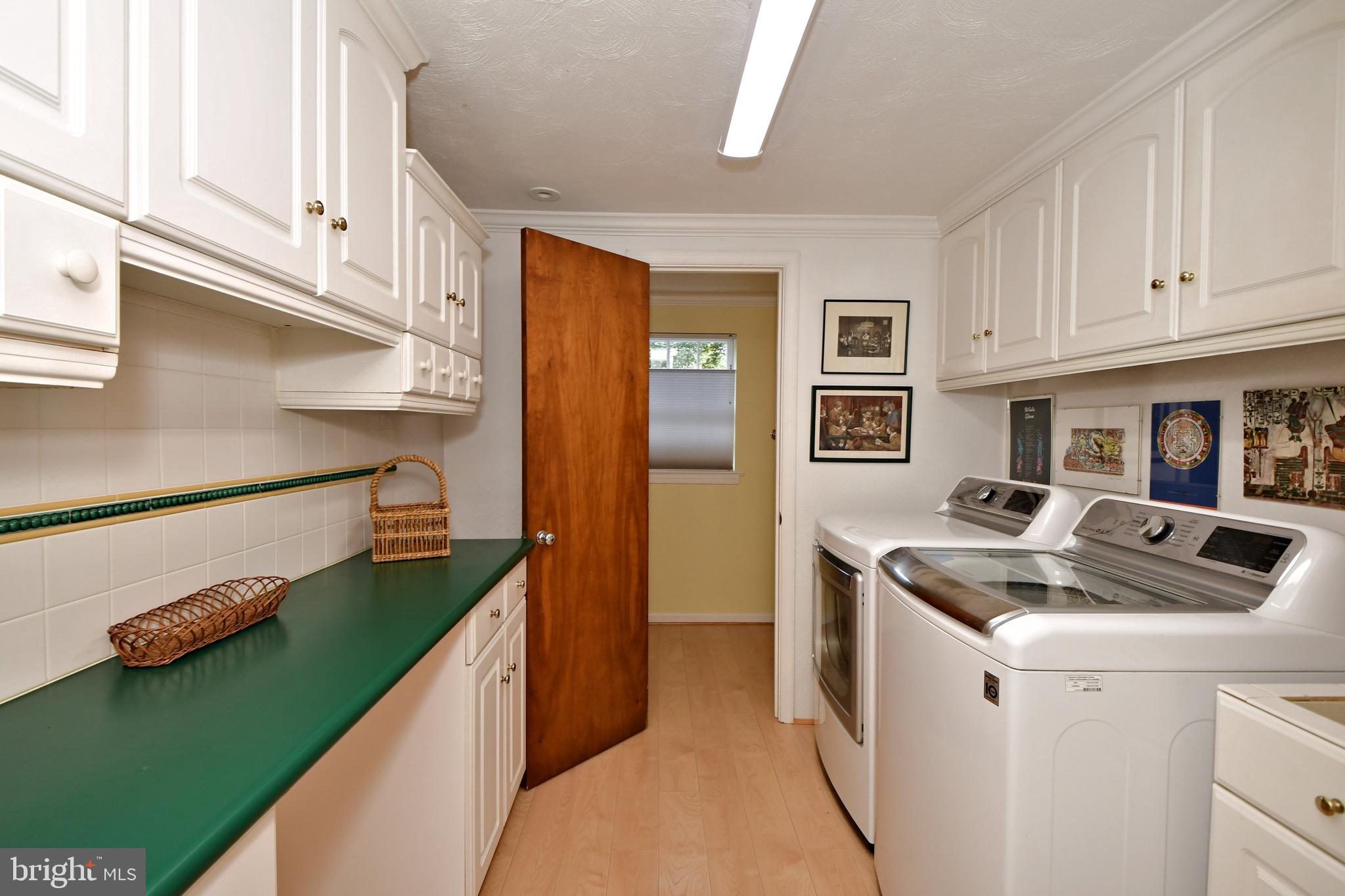 335 Powderhorn Road Fort Washington, PA 19034 - Photo 29 of 41 Mudroom with laundry, powder room at end