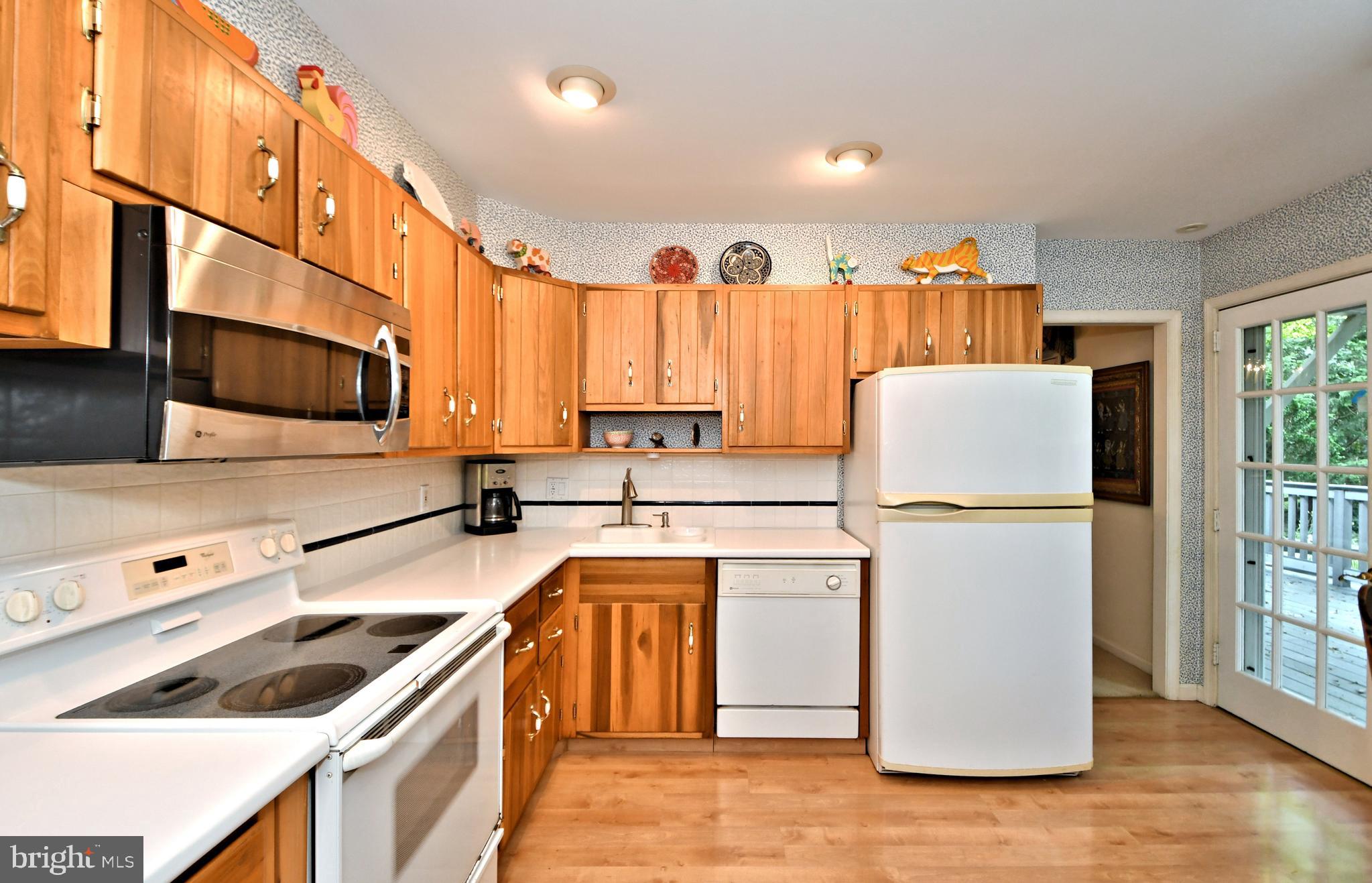335 Powderhorn Road Fort Washington, PA 19034 - Photo 9 of 41 Recessed lights and Corian counters