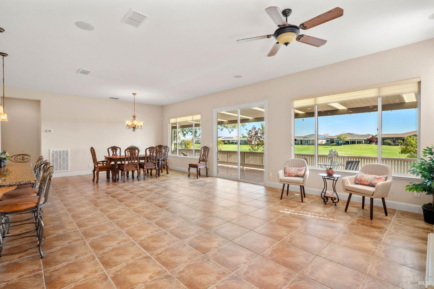 210 Magnolia Drive Rio Vista, CA 94571 - Photo 12 of 69 living room and dining room with windows overlooking golf course