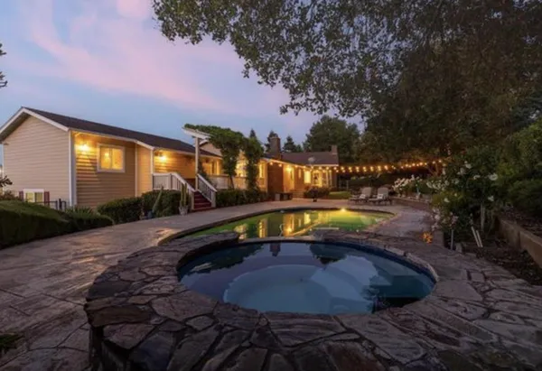 a view of a house with a yard