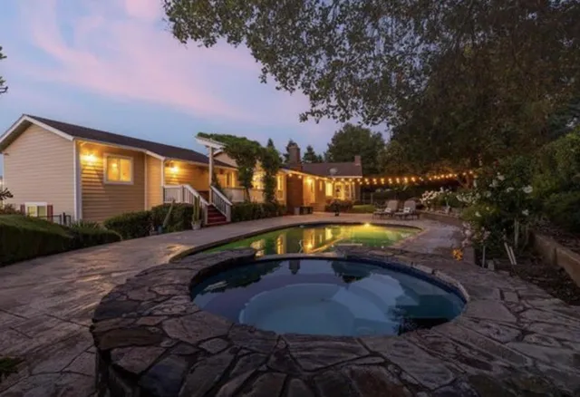 a view of a house with a yard