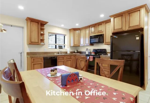 a view of a backyard with sitting area and furniture