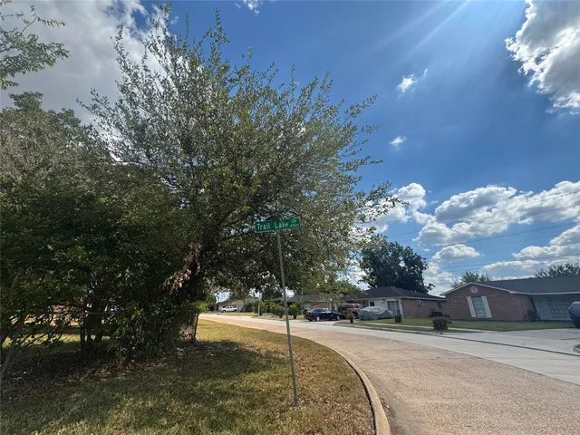 a view of a playground with a house