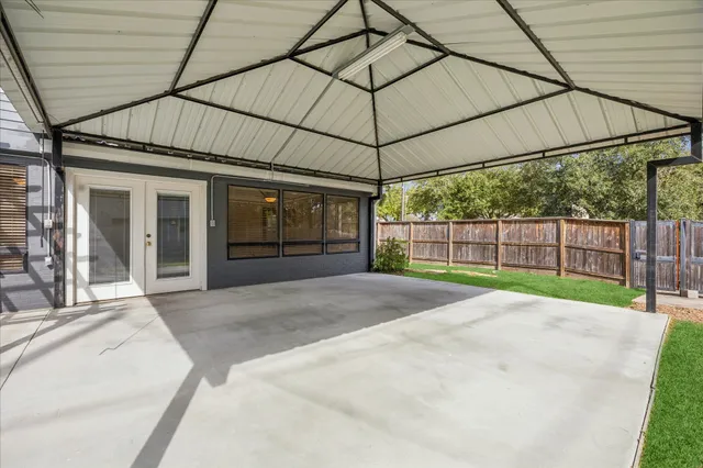 a view of a backyard of the house