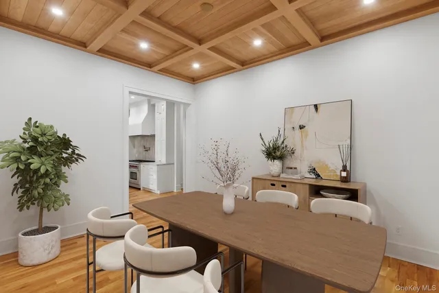 a dining room with furniture and wooden floor