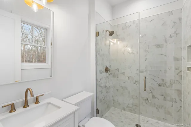 a bathroom with a shower and a sink
