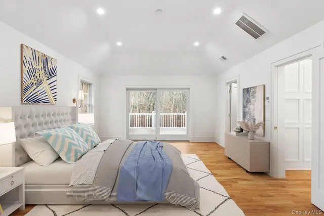 a spacious bedroom with a large bed and a couch