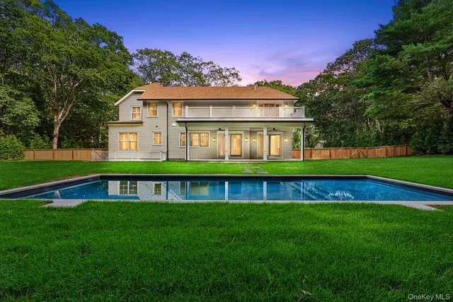 a front view of a house with a big yard