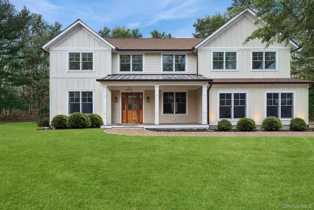 a front view of a house and a yard